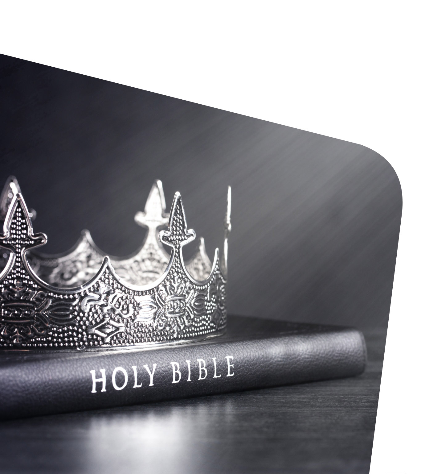 Holy Bible and a Kings Crown on a Dark Background