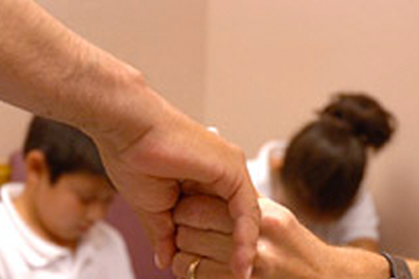 Holding hands in prayer