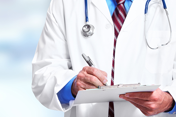 Doctor Performing Health Assesment