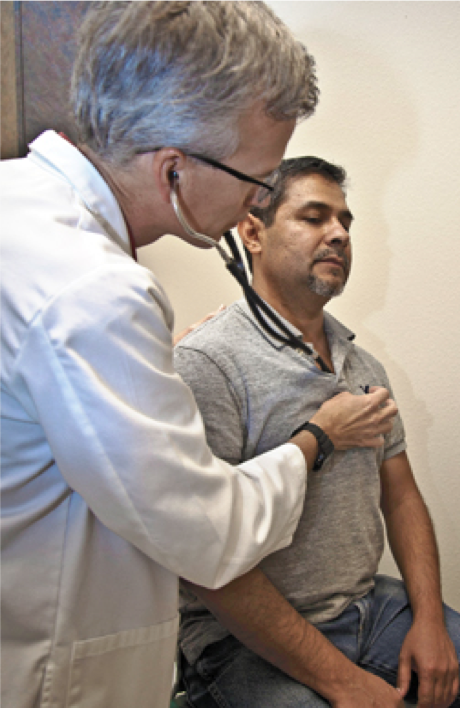 Doctor Performing Health Assesment